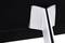 Back of a monitor with a stylised, silver stand protruding from a black casing.