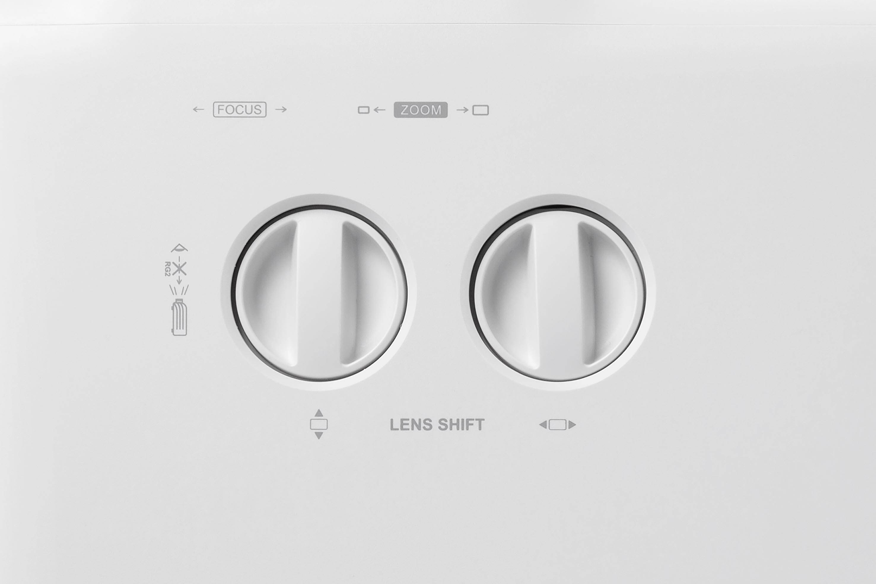 'Two knurled wheels on a white device with labels: 'FOCUS' and 'ZOOM' at the top, 'LENS SHIFT' at the bottom.'