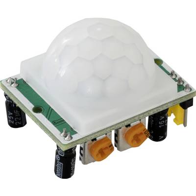 A motion sensor module with a white dome on a green circuit board. It has capacitors and connectors on the underside.