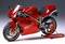 A red motorbike on a stand, captured from an angled side view. Caption reading "Ducati 916". Sporty design, with no background details.