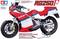 A model kit of a Suzuki RG250, scale 1:12, with red and white design. Includes full options and is offered by Tamiya.