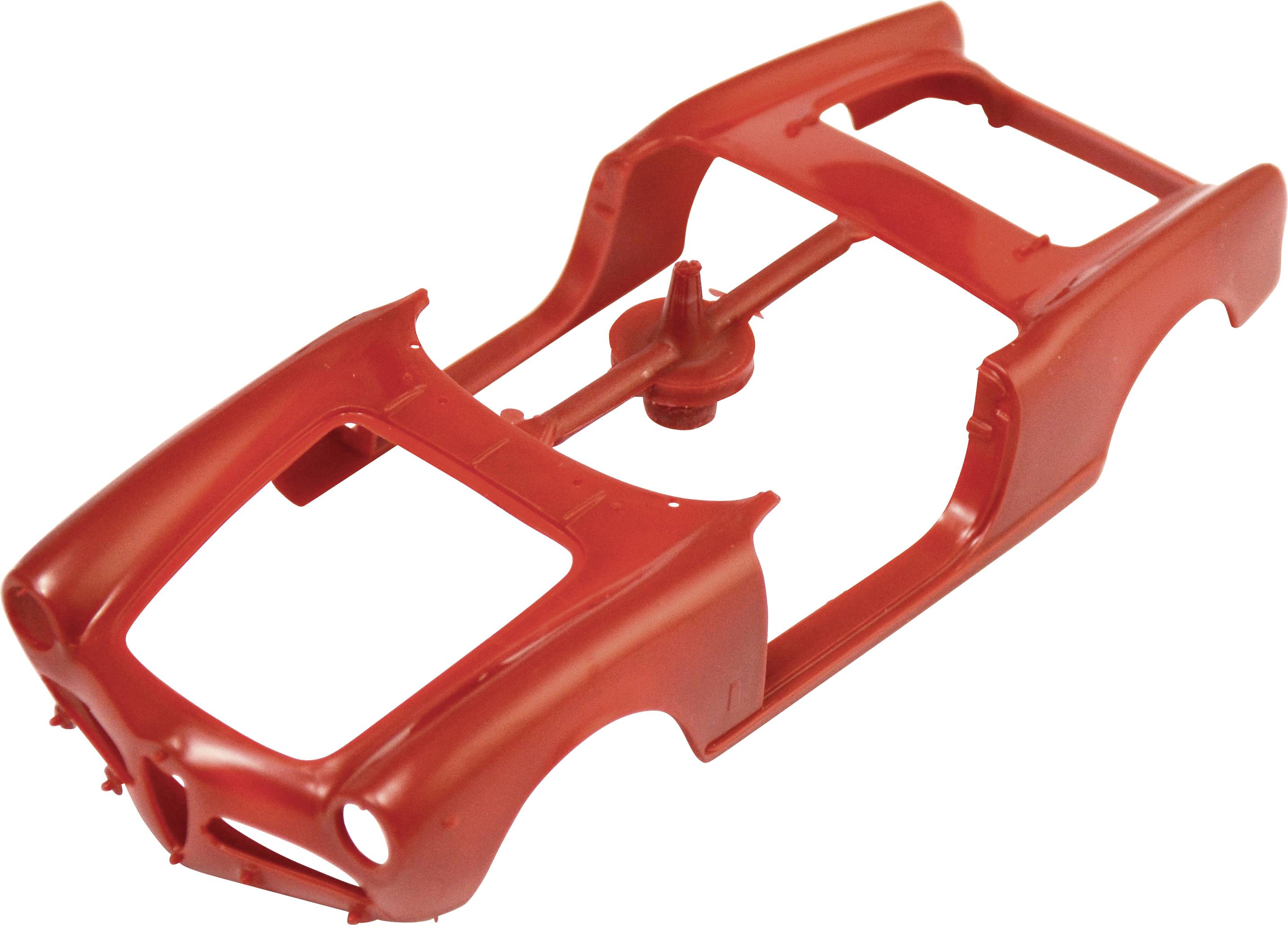 Red plastic model of a car chassis without bodywork or wheels.