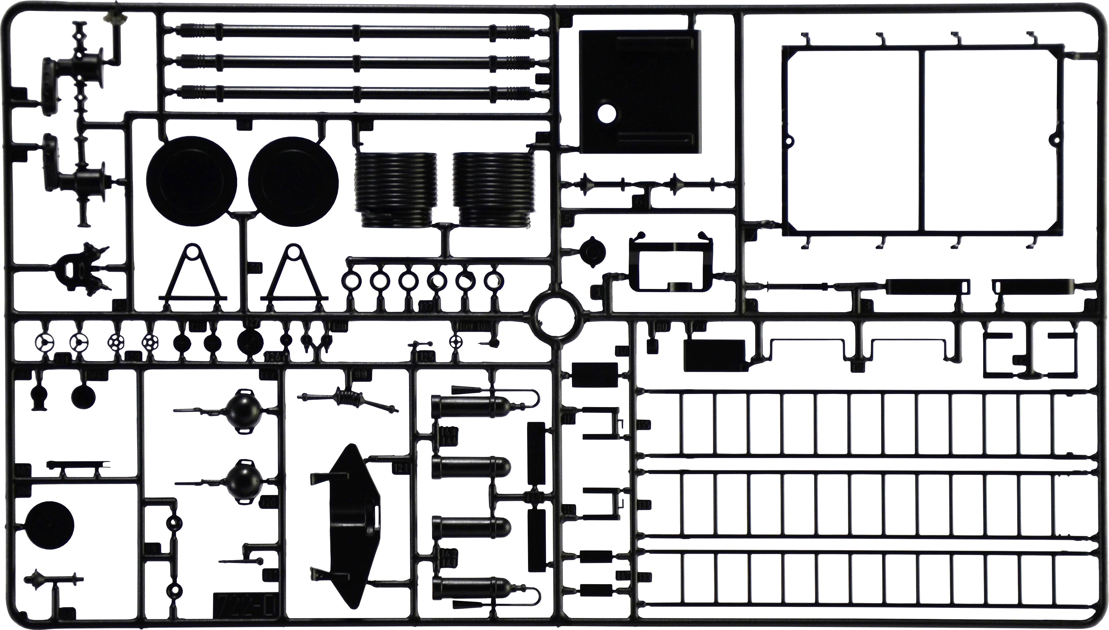 'Black plastic injection mouldings with various components for model making, including wheels, rods and panels, on a grid frame.'