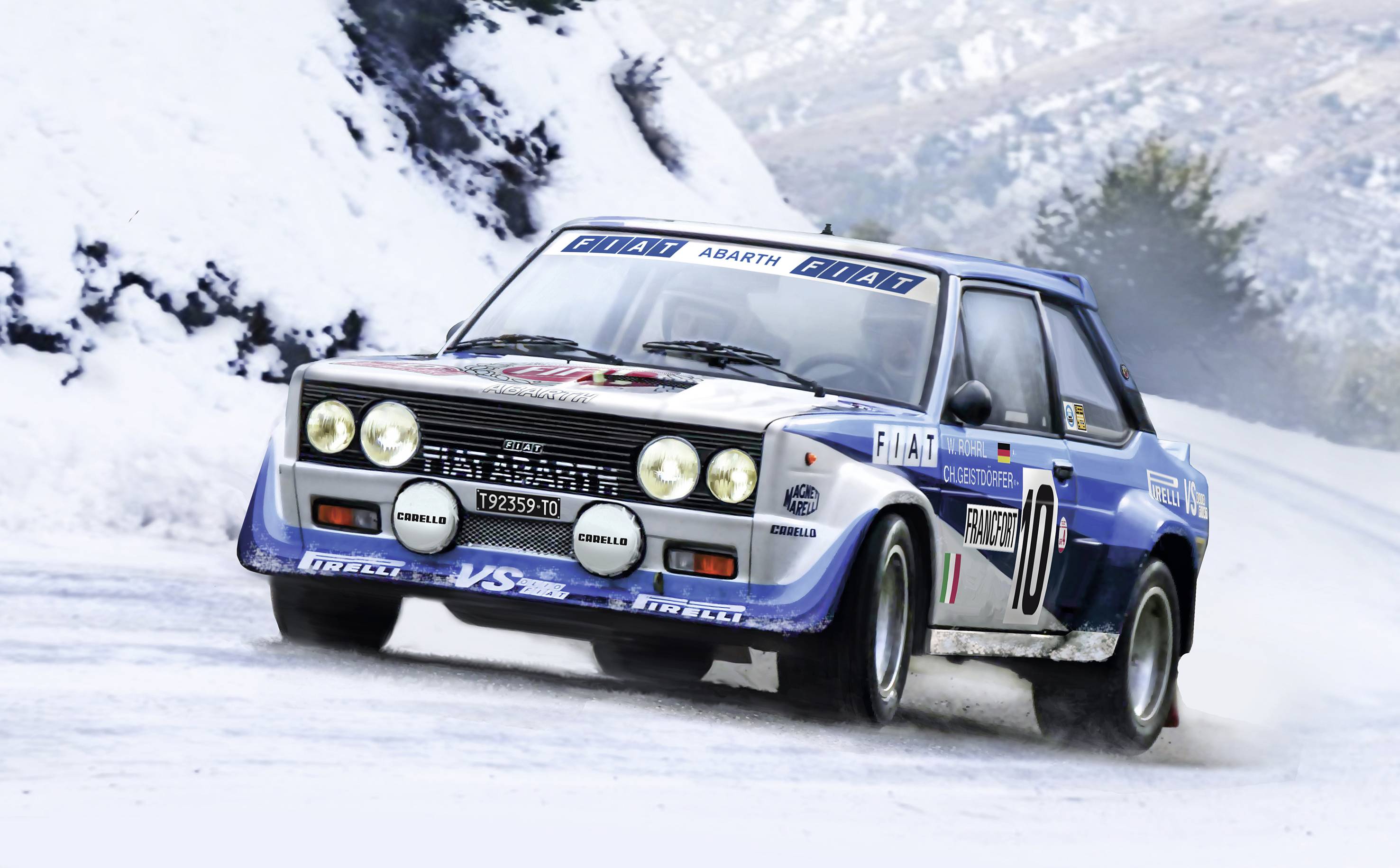 A rally car speeds along a snow-covered road in a wintry landscape. The car has blue and white racing stripes.