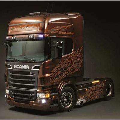 A Scania lorry in a dark brown shade, with the text 'Black Amber', decorative flame pattern on the bodywork, set against a dark background.