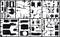 A plastic model kit in black with various car components on a grid frame, ready to be removed and assembled.