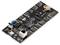 A black development board with multiple ports, including USB and Ethernet, along with a battery holder.