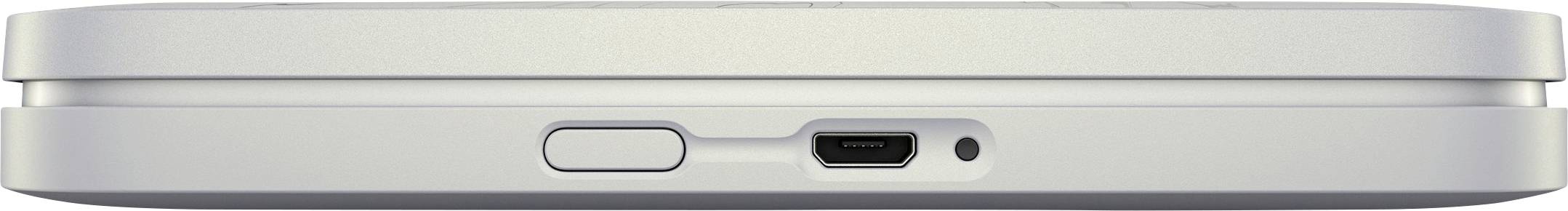 Silver electronic device shown from the side, with a side port and a round button to the left of the port.