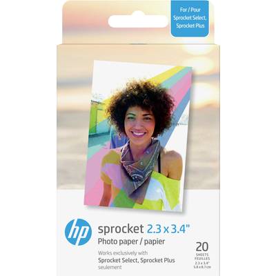 Woman with curly hair smiles in front of a colourful striped background. On the packaging it says 'HP Sprocket 2.3 x 3.4" Photo Paper'.