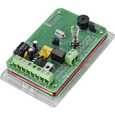 A green printed circuit board with various electronic components such as capacitors, inductors, and multiple terminal blocks.