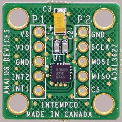 A green printed circuit board module with the inscription 'INTEMPCO MADE IN CANADA'. It contains multiple connectors and a microchip.