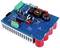 Electronic circuit with capacitors and inductors on a blue printed circuit board. Depicts components of a circuit board for technical applications.
