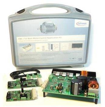 A suitcase labelled 'iMOTION' contains a motor control set. Electronic components are laid out on a circuit board in front of it.