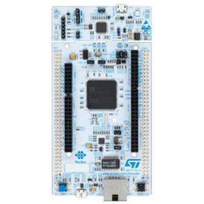 A microcontroller development board with various ports, a large central chip, and a USB interface on top.