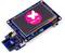 A STM32 development board with a display showing the STM32 H7 logo on a pink background with a butterfly symbol.