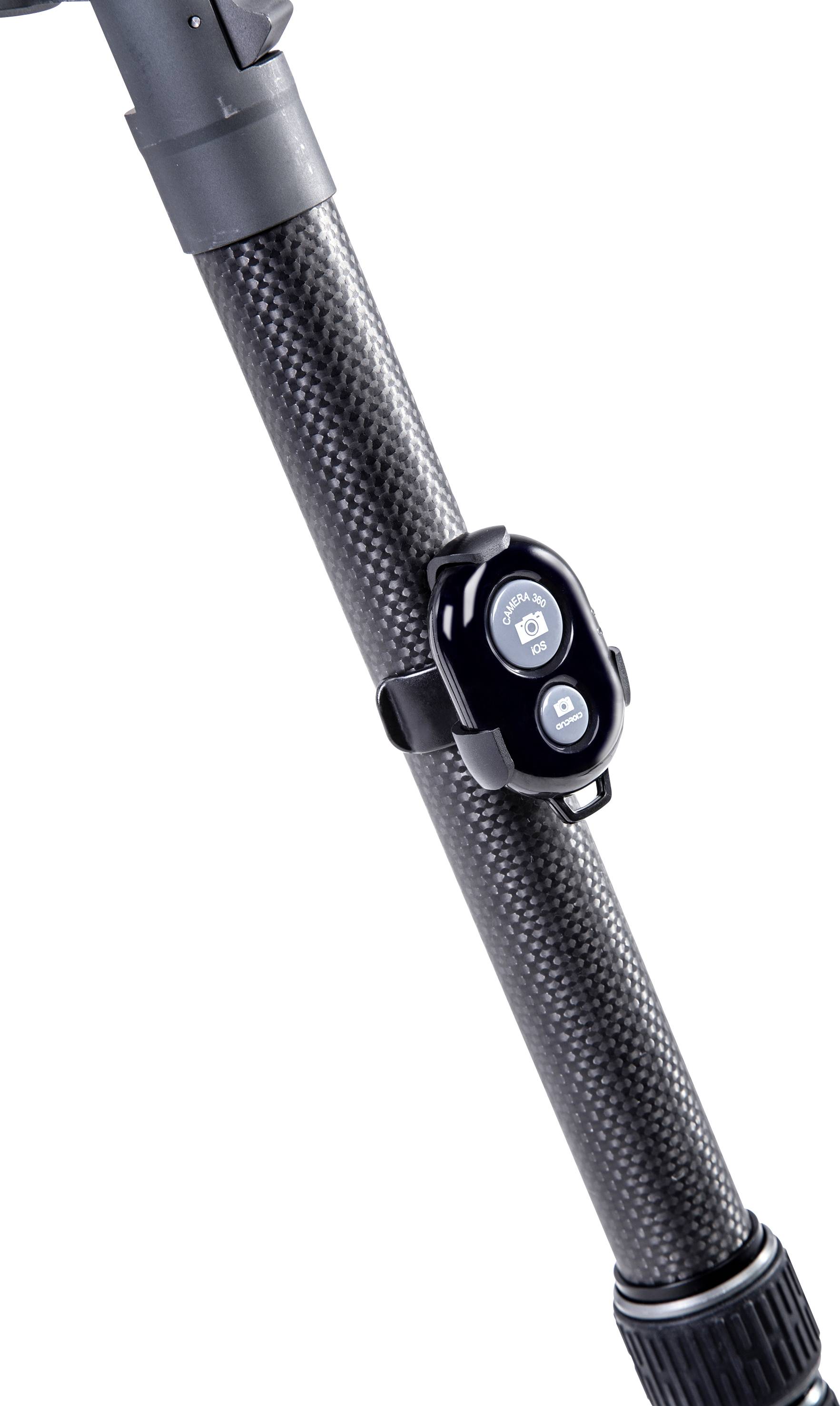Close-up of a tripod leg made of carbon fibre, with a small, mounted remote control.