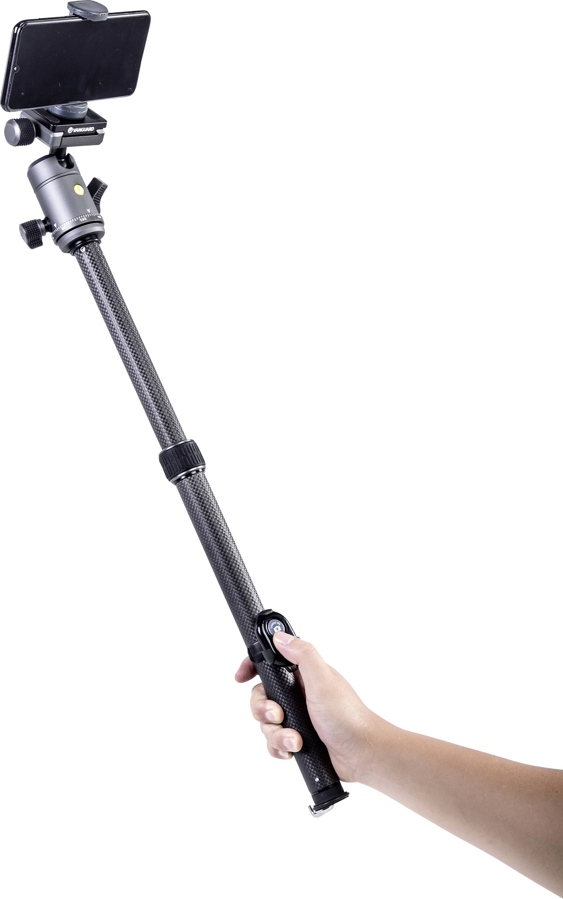 A hand is holding a selfie stick with a smartphone attached to it, against a white background.