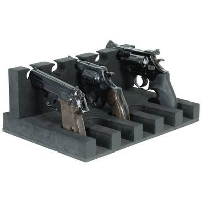 'Three pistols arranged side by side in a black stand.'