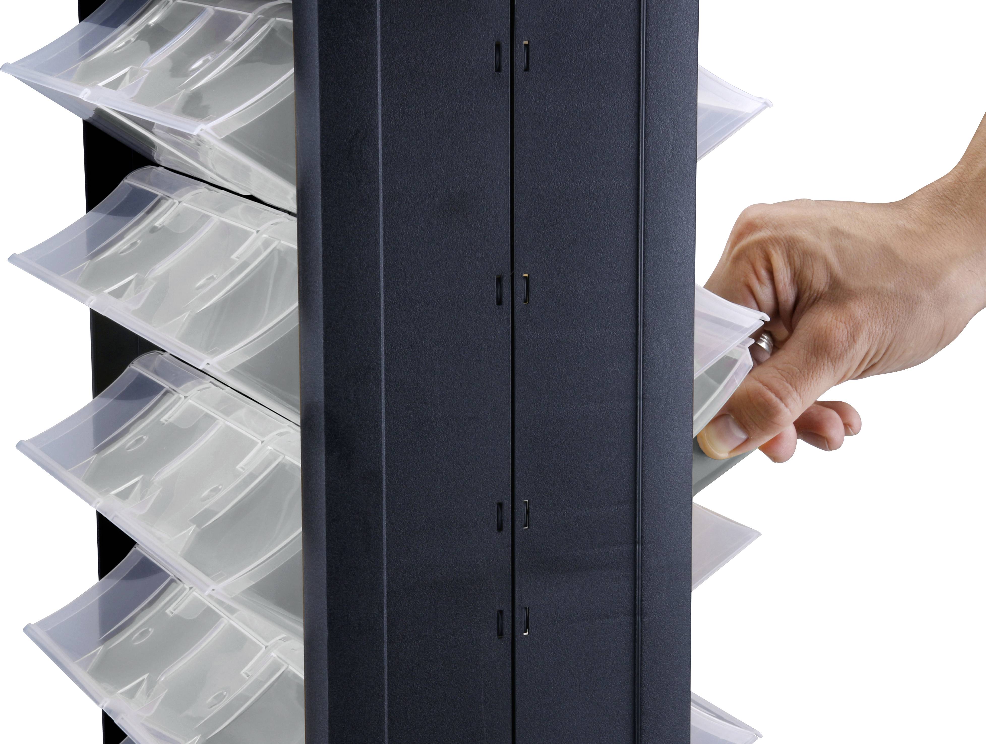 A hand reaches for a card from a rotating black card holder with transparent sections.