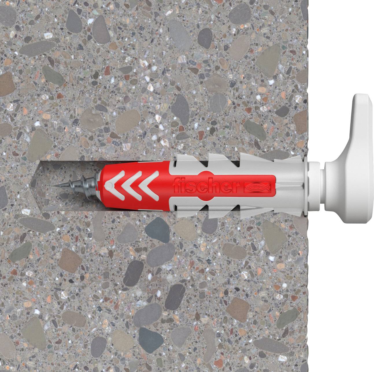 A wall plug in a concrete wall securing a construction tool. The plug shows a white and red structure within the hole.
