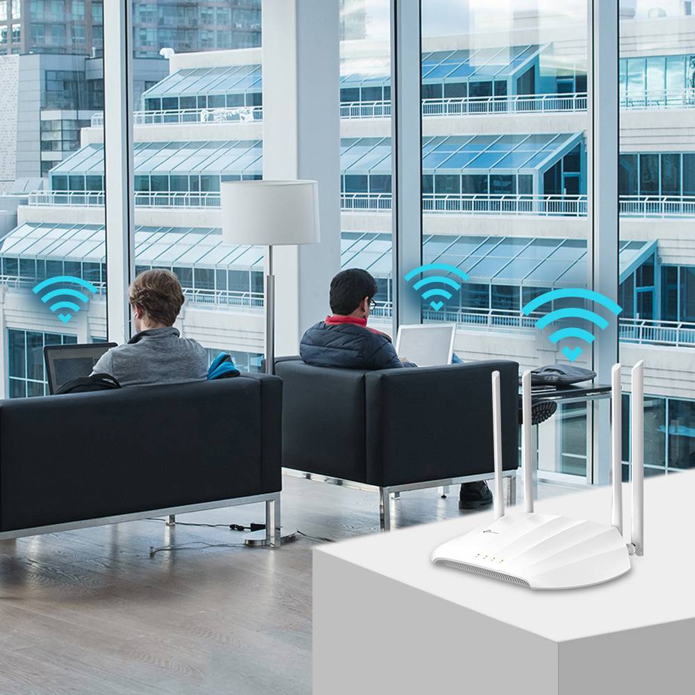 Two people with laptops, connected via Wi-Fi signals in a modern office; a router in the foreground, signal strength iconically represented.