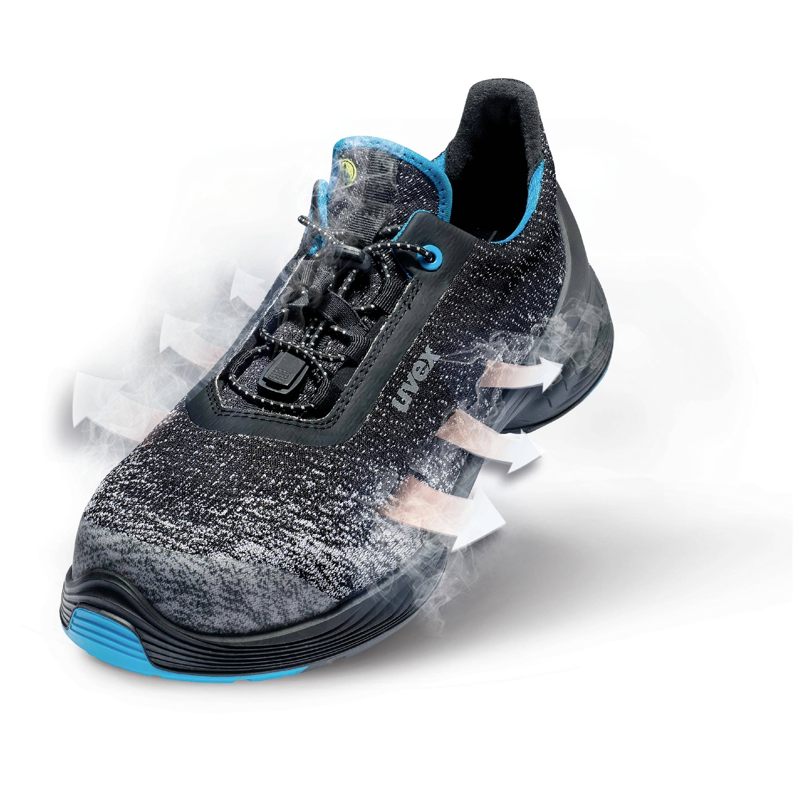 A black sports trainer with a dark blue sole. White arrows indicate air circulation through the material, suggesting breathability.