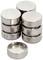 'Stack of silver button cell batteries, some standing, others lying down.'