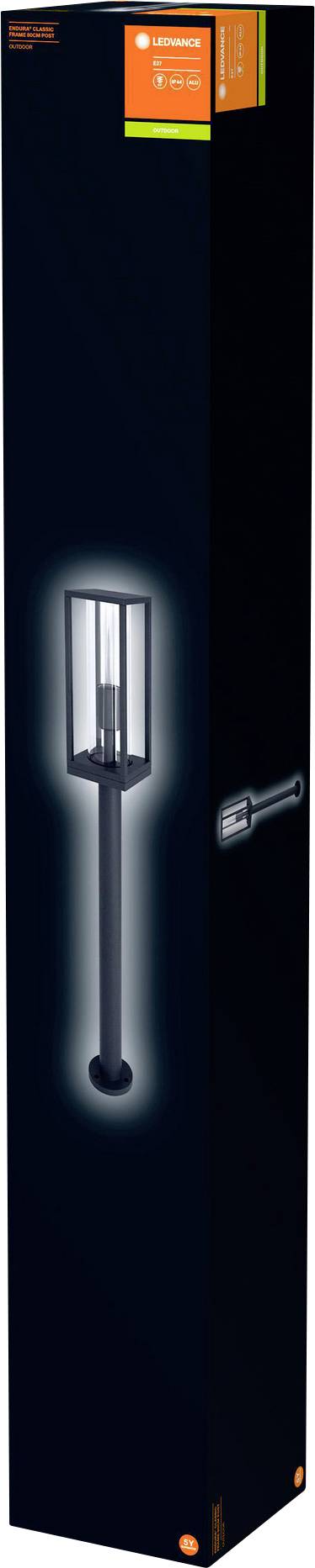 A black outdoor lamp in a tall, narrow cardboard box, pictured illuminated, with a cylindrical design and a high base stand.
