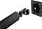 Black monitor arm and wall mount. The arm has a hinge in the middle. Mount has screw holes for attachment.