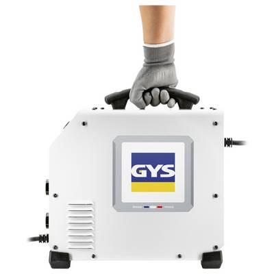 Gloved hand carrying a white GYS welding machine with a top handle, shown on a plain background.<br>