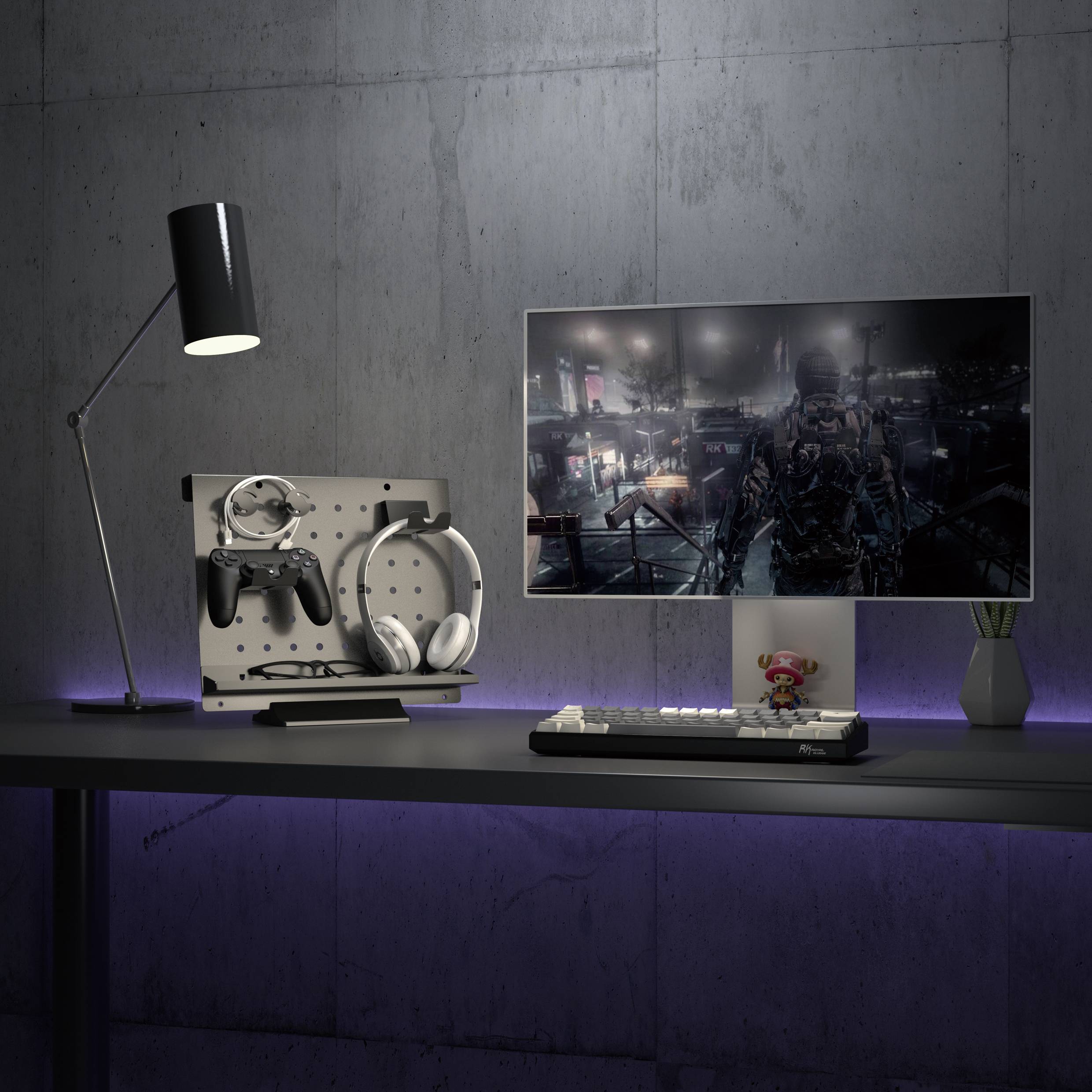 A modern desk with a large monitor displaying a video game, keyboard, mouse, and gaming accessories stylishly arranged.