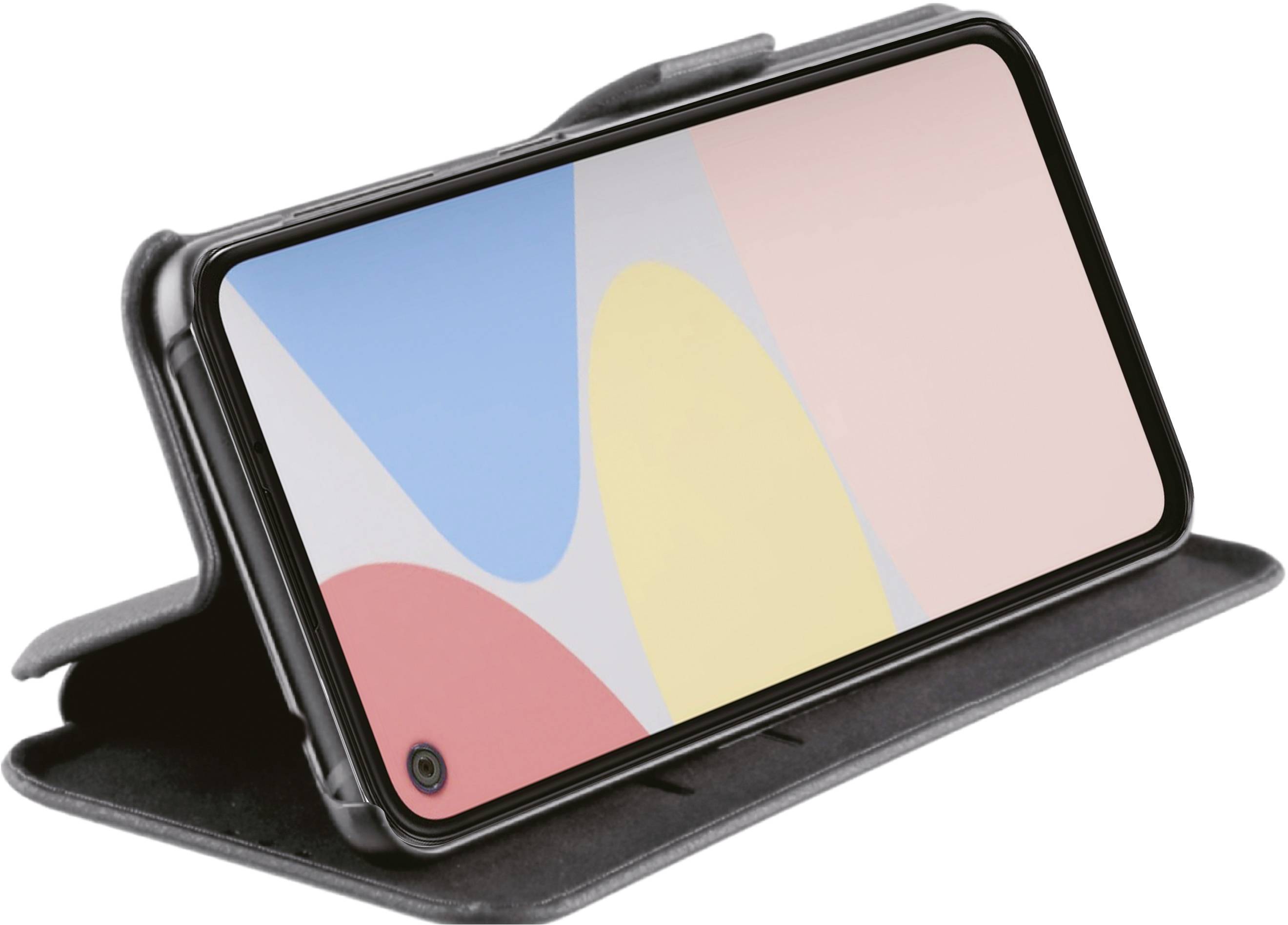 A smartphone in a black folding case is propped up in landscape orientation. The screen displays a colourful, abstract pattern.