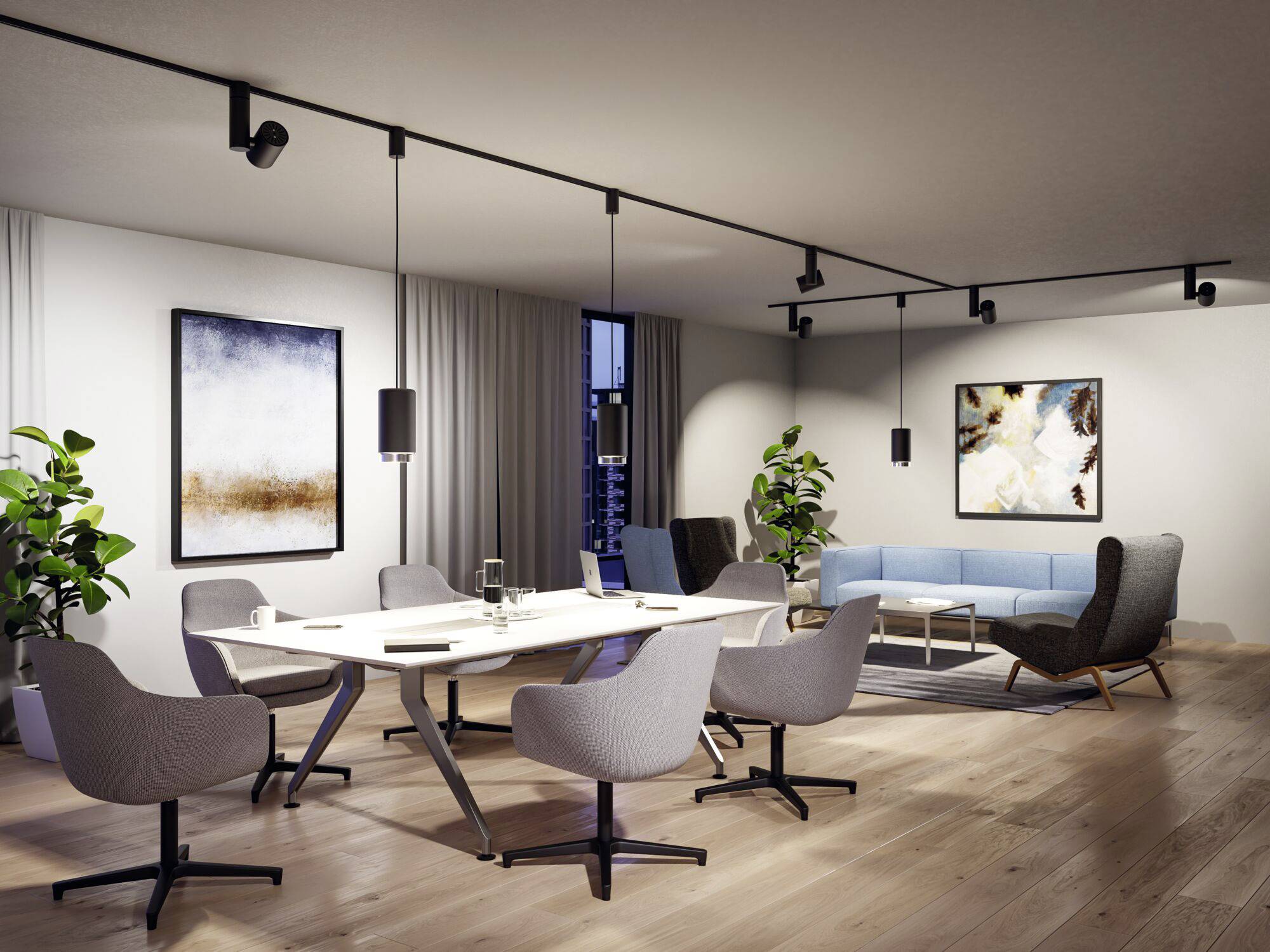 A modern conference room with a large oval table, surrounded by grey chairs. Abstract paintings hang on the walls.