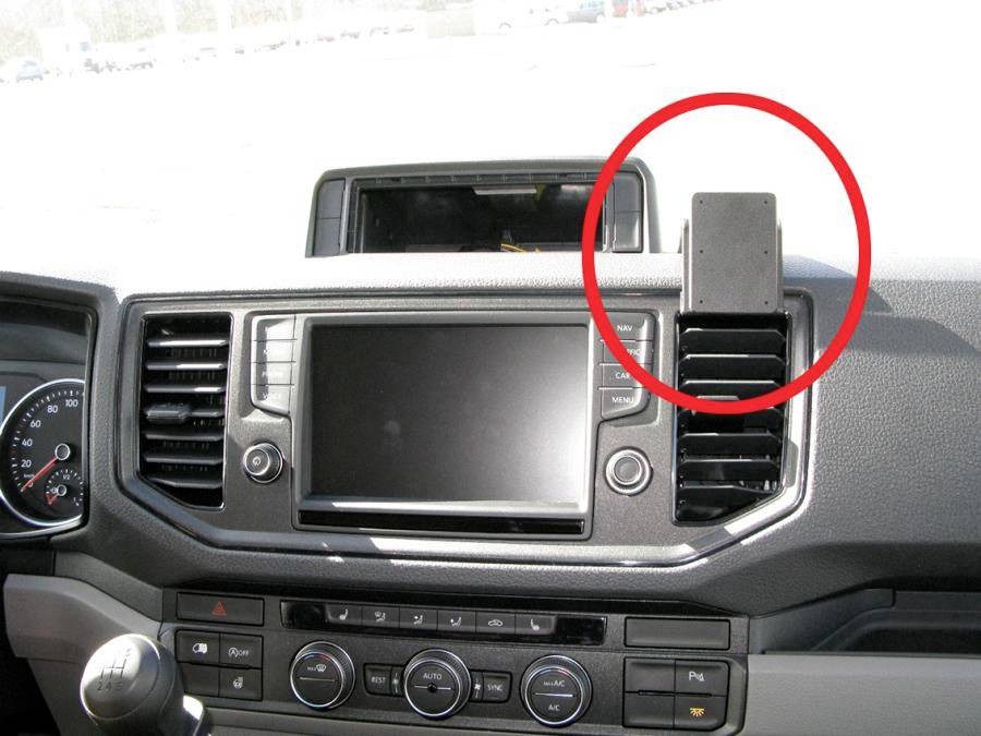 Mobile phone holder in the car with a red marker, positioned on the right side of the dashboard above the air vents.