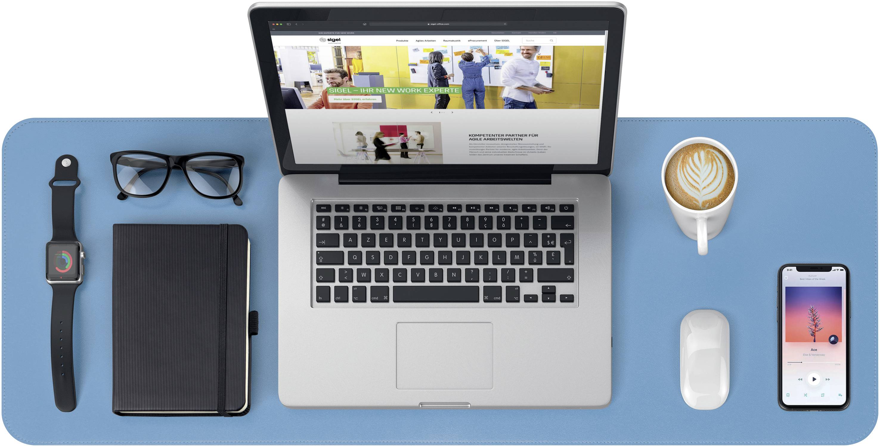 A tidy desk with a laptop, glasses, notebook, smartwatch, coffee cup, smartphone and mouse on a blue background.