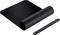 A rolled-up black leather desk mat with a matching fastening strap. Perfect for stylish office organisation.