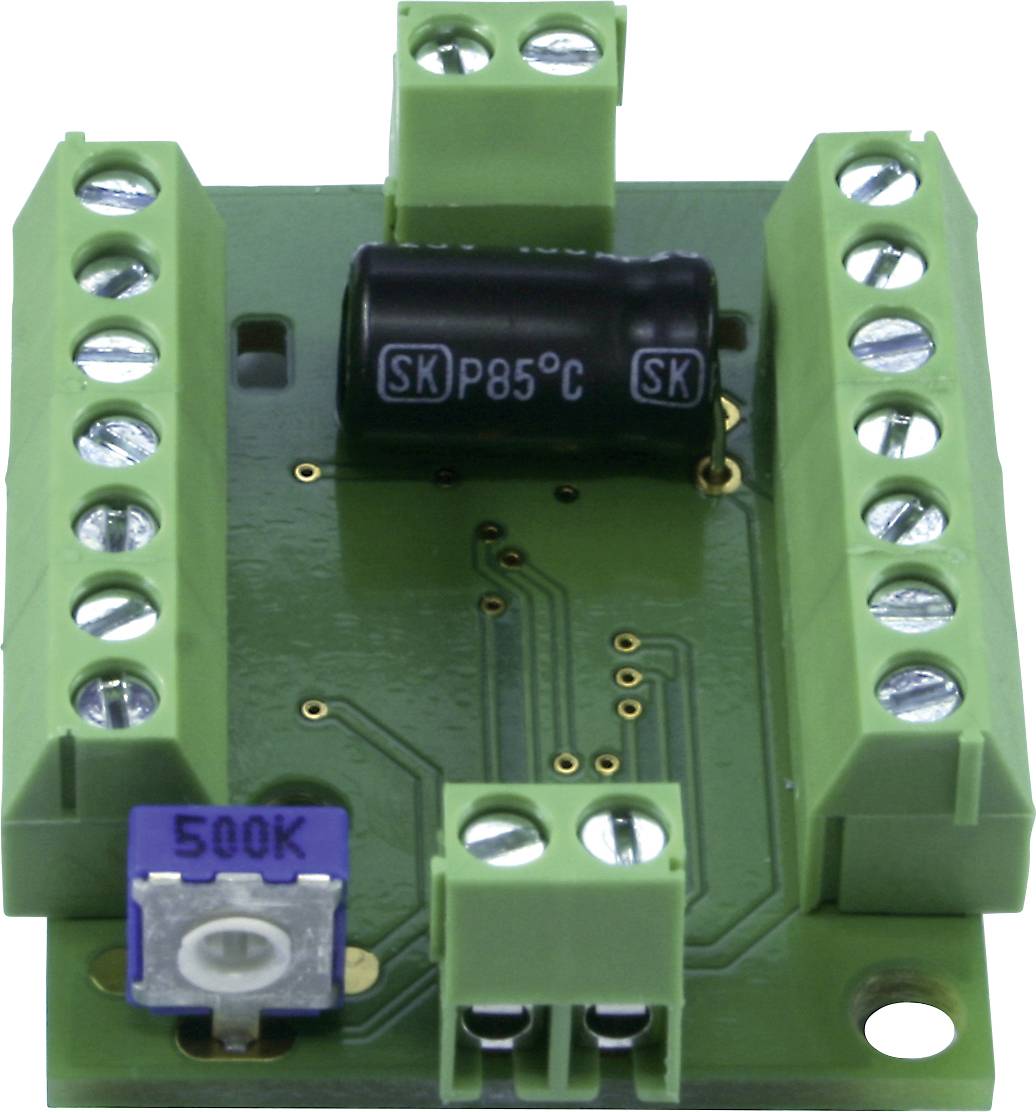Electronic green circuit board with multiple screw terminals and a visible capacitor. Used in electrical circuits.