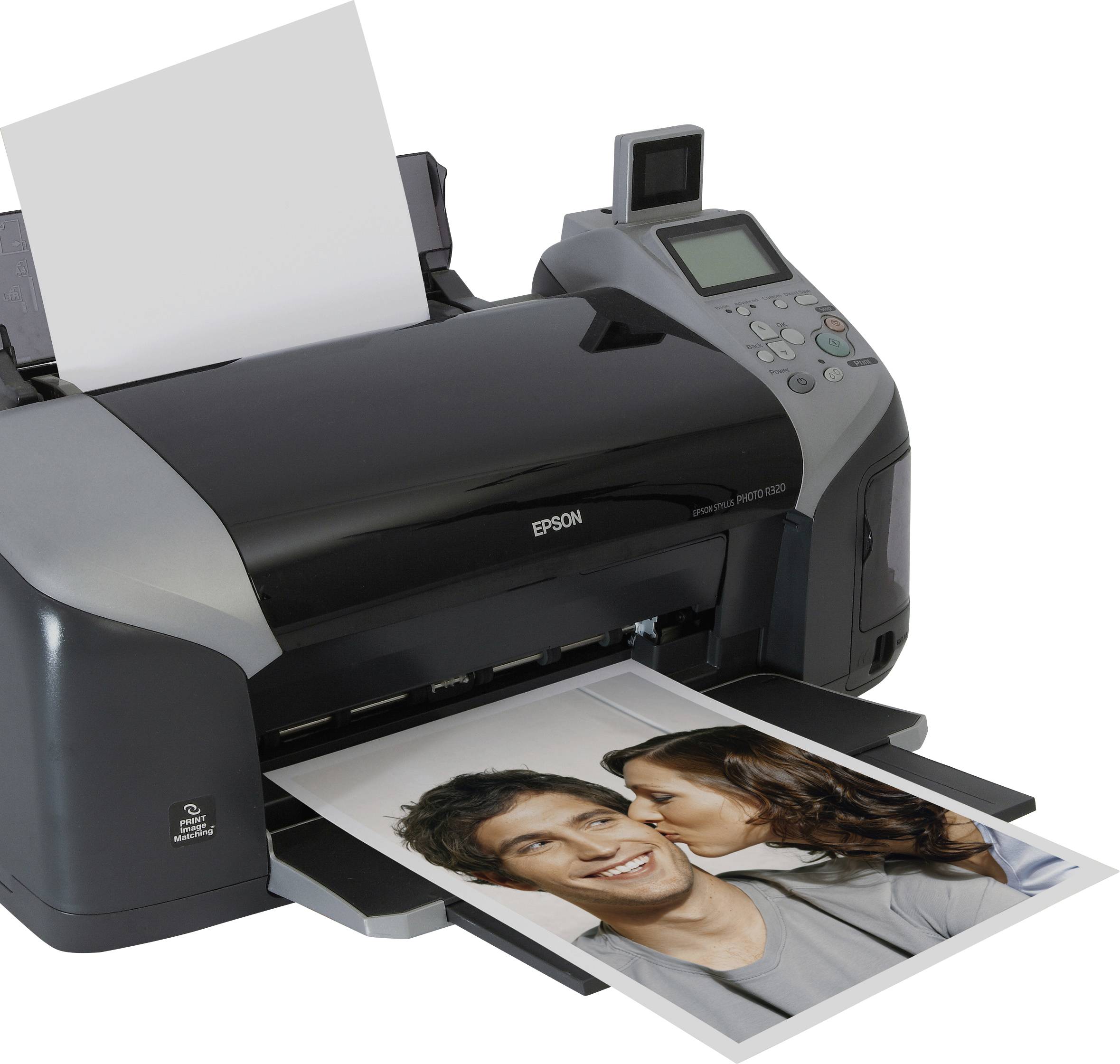 A printer on a table is printing out a photo of a smiling couple. Unprinted paper is still visible above the printer.