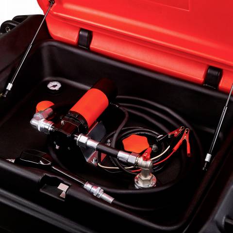 An orange and black portable compressor in a case, surrounded by hoses and accessories, ready for use.
