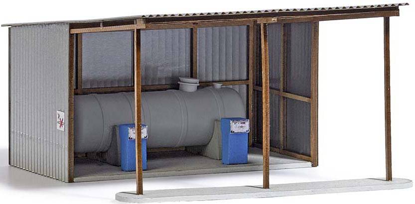 A model of a simple, covered storage area with a large, horizontal tank and two blue plastic containers on a concrete floor.