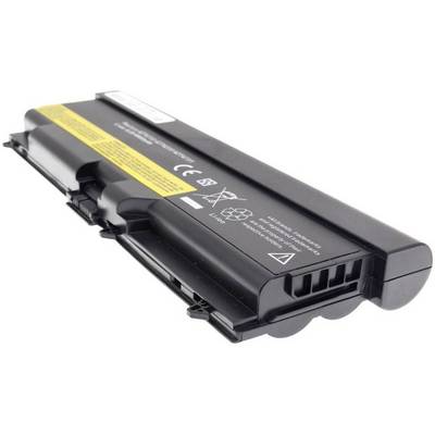 A black laptop battery with a yellow label and safety symbols is lying on a white surface.