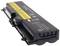 Black laptop battery with a yellow label displaying technical information, safety instructions, and recycling guidance.