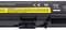 Black laptop battery with a yellow warning sticker: 'CAUTION: Protect the battery pack from heat and fire; never throw into fire.'