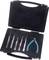 An open tool case with various precision tools, including tweezers and side cutters, nestled in foam padding.