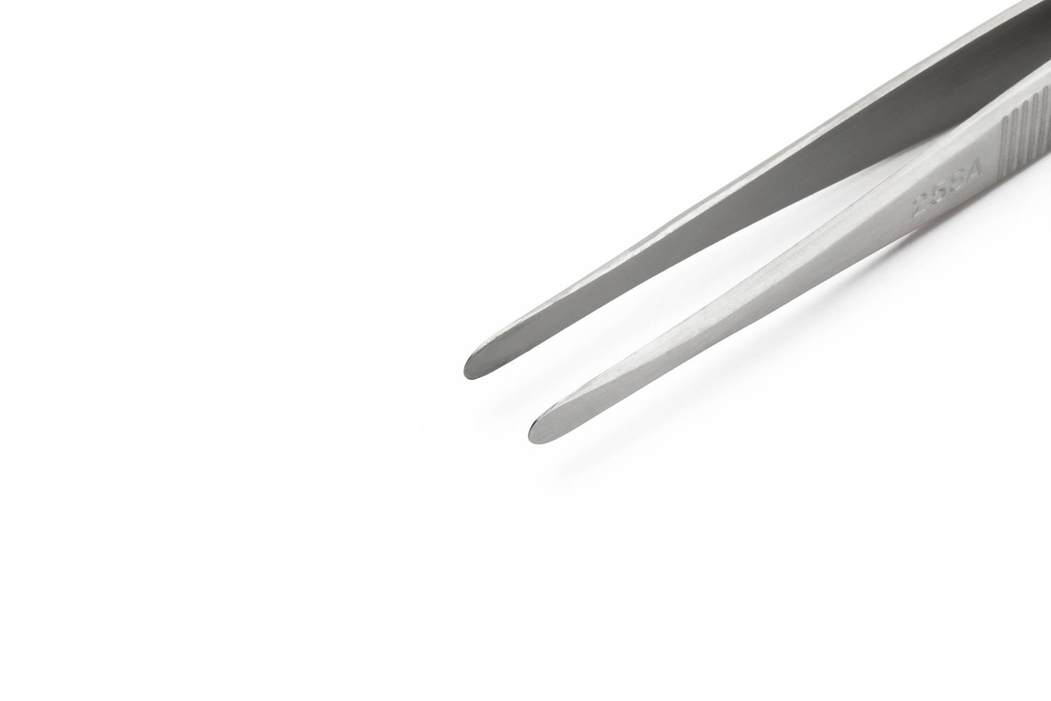 A silver pair of tweezers in close-up on a white background.
