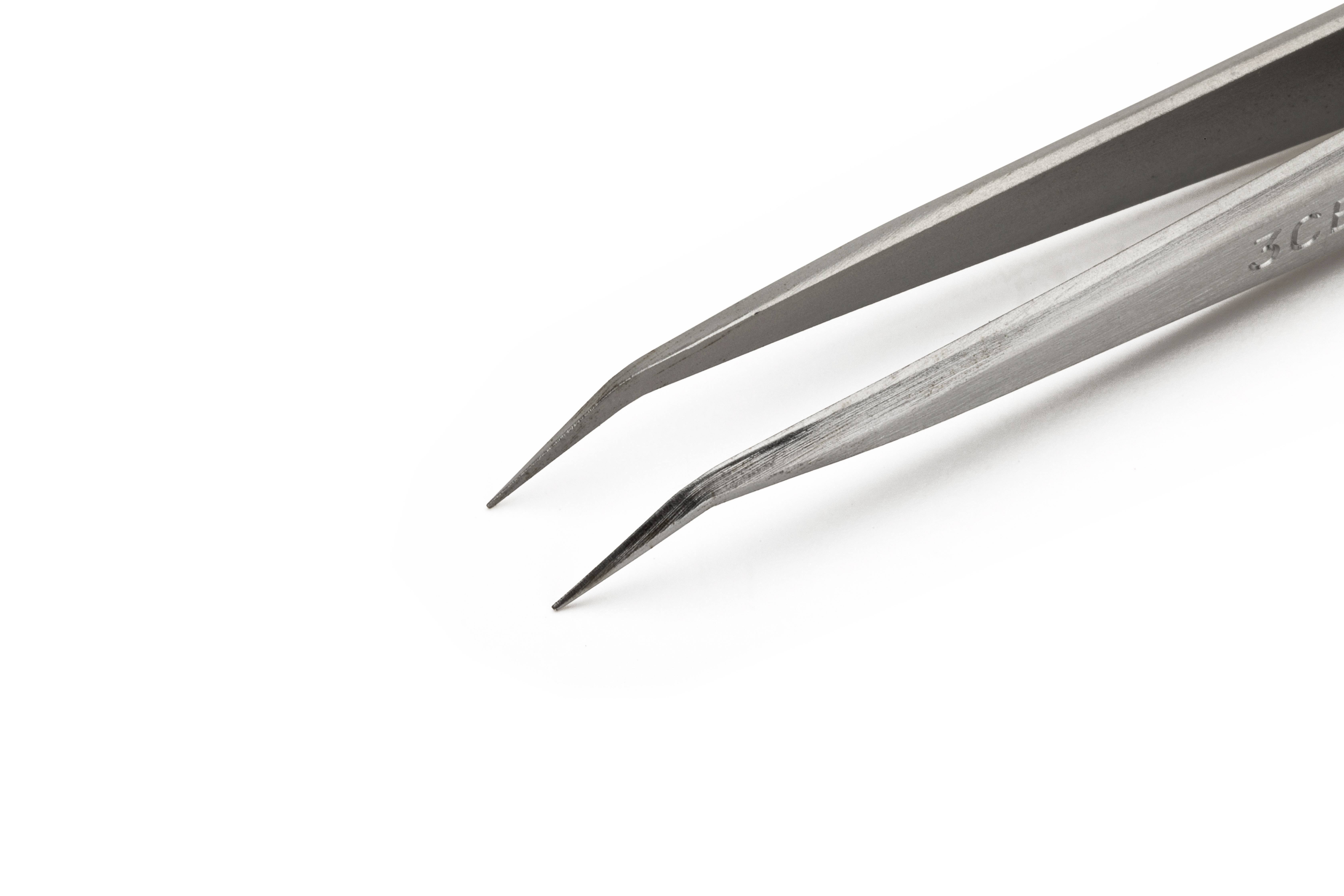 Metal tweezers, tapering to a point, against a white background. Primarily used for precise handling of small objects.