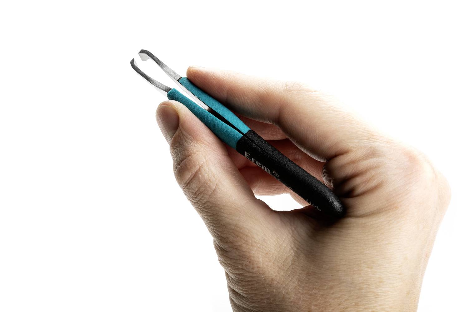 A hand is holding a blue-black pair of tweezers against a white background.
