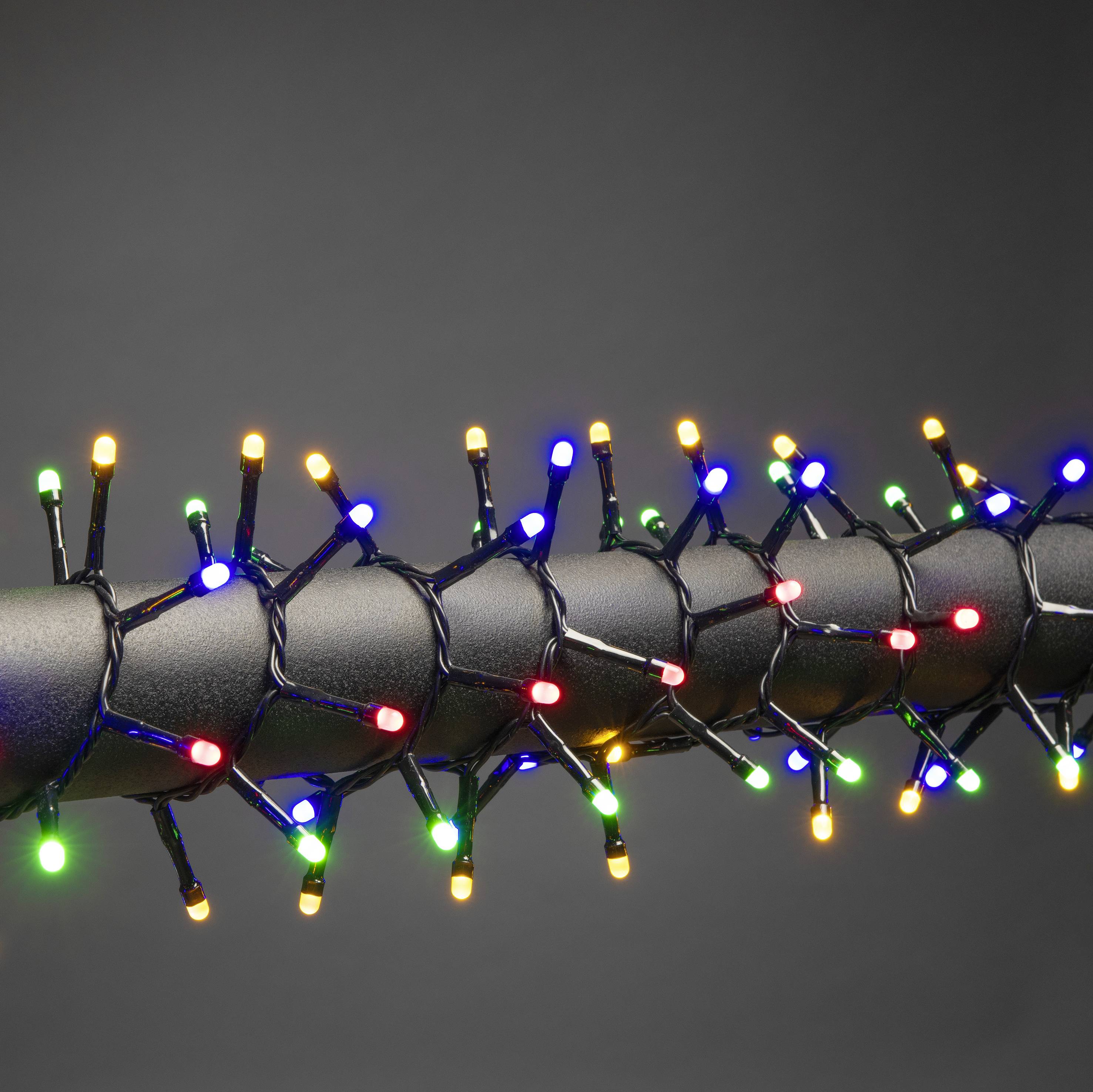 String of fairy lights with colourful LED lights wound around a black cable, illuminated against a neutral background.