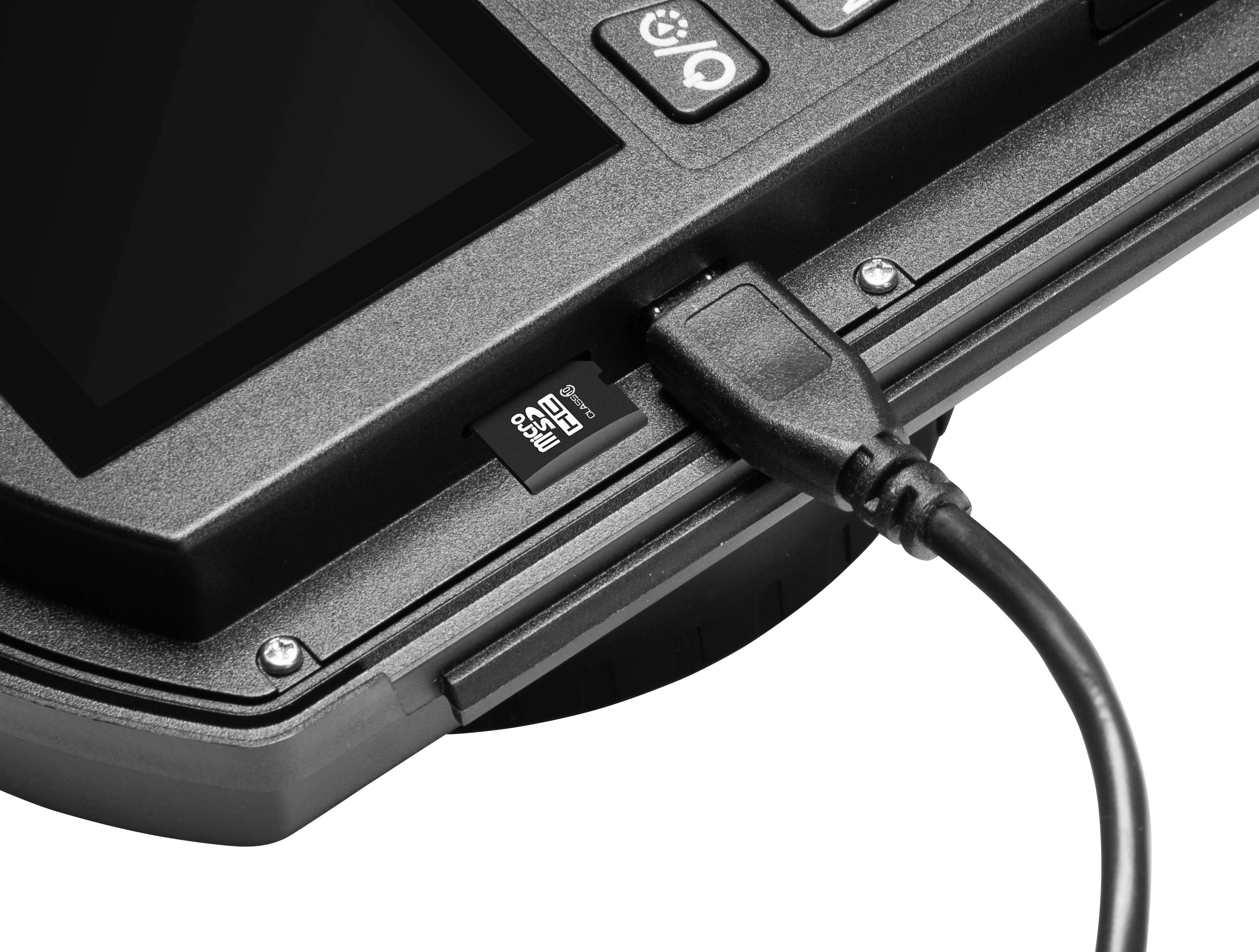 A black cable is connected to an electronic screen. Next to the connection, there is a card slot.