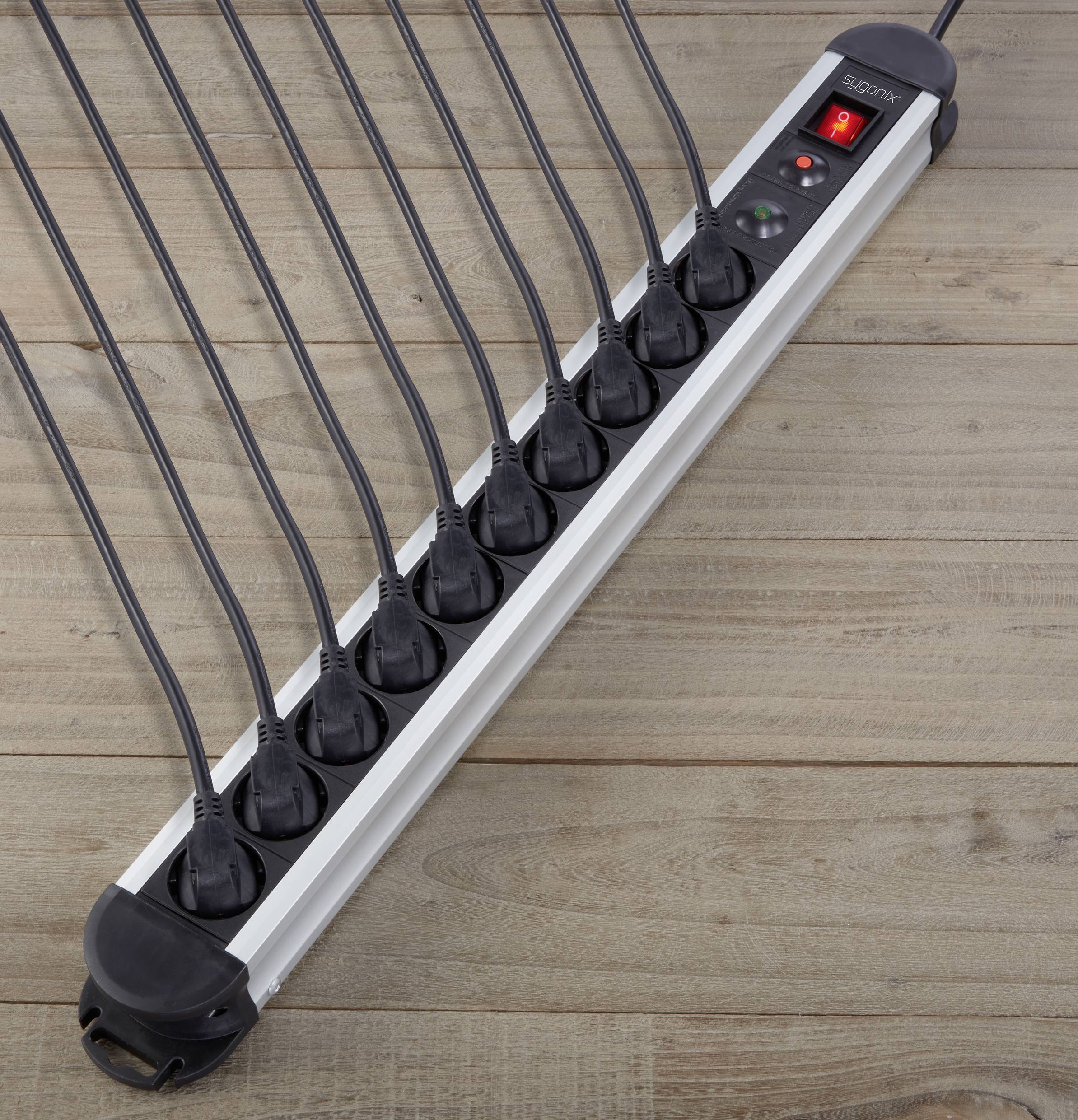 A multi-socket extension lead with ten plug sockets and a red illuminated switch on a wooden floor.